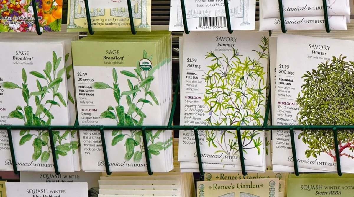 a row of Botanical Interests seed packets in a store display.